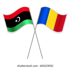 Libyan and Romanian crossed flags. Libya combined with Romania isolated on white. Language learning, international business or travel concept.