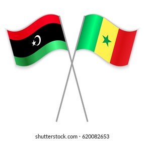 Libyan and Senegalese crossed flags. Libya combined with Senegal isolated on white. Language learning, international business or travel concept.