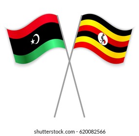 Libyan and Ugandan crossed flags. Libya combined with Uganda isolated on white. Language learning, international business or travel concept.