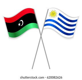 Libyan and Uruguayan crossed flags. Libya combined with Uruguay isolated on white. Language learning, international business or travel concept.