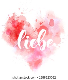 Liebe - Love in German. Handwritten modern calligraphy lettering text on abstract watercolor painted heart.