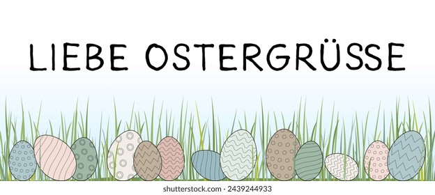 Liebe Ostergrüße - text in German language - Easter greetings. Greeting card with pastel-colored Easter eggs in the grass.