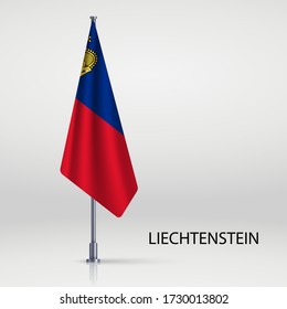 Liechtenstein hanging flag on flagpole