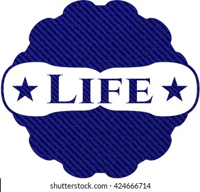 Insignia de vida con fondo de denim