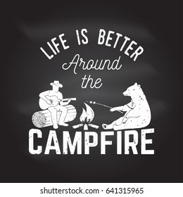 Life is better around the campfire on the chalkboard. Vector illustration. Concept for shirt or logo, print, stamp or tee. Vintage design with campfire, bear, man with guitar and forest silhouette.