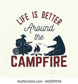 Life is better around the campfire. Vector illustration. Concept for shirt or logo, print, stamp or tee. Vintage typography design with campfire, bear, man with guitar and forest silhouette.