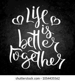 Life is better together. Hand written calligraphy quote motivation for life and happiness on blackboard. For postcard, poster, prints, cards graphic design.