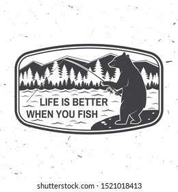 Life is better when you fish. Summer camp. Vector illustration. Concept for shirt or logo, print, stamp or tee. Vintage typography design with fishing bear, mountains, sky and forest silhouette.