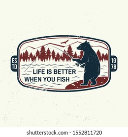 Life is better when you fish slogan. Summer camp. Vector illustration. Concept for shirt or print, stamp or tee. Vintage typography design with fishing bear, mountains, sky and forest silhouette.