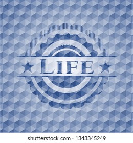 Life blue badge with geometric pattern background.