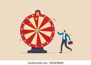 Life depend on luck, fortune wheel randomness, chance and opportunity to get new job, investment winning or gambling concept, excite businessman looking at spinning fortune wheel waiting for luck.