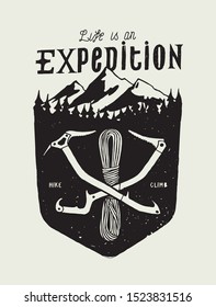 Life is Expedition - crossed ice axes and rope in front of the montein range and woods - vintage typography badge - vector silkscreen t-shirt print