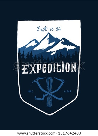 life is an expedition - mount range and crossed ice axes vintage shield shaped typography t-shirt design for screen printing