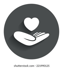 Life insurance sign. Hand holds human heart symbol. Health insurance. Circle flat button with shadow. Modern UI website navigation. Vector