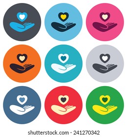 Life insurance sign. Hand holds human heart symbol. Health insurance. Colored round buttons. Flat design circle icons set. Vector