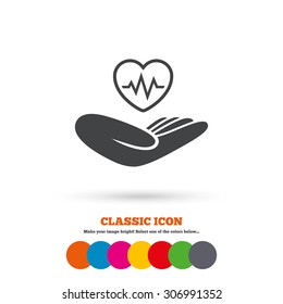 Life insurance sign. Hand holds human heart symbol. Health insurance. Classic flat icon. Colored circles. Vector