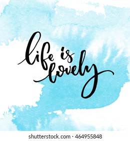 Life Is Lovely. Inspiration Quote Handwritten On Blue Watercolor Swash Texture