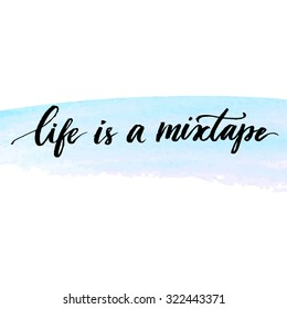 Life is a mixtape. Inspirational quote handwritten with modern calligraphy at delicate blue watercolor stroke. Vector lettering design for cards, prints and social media content.