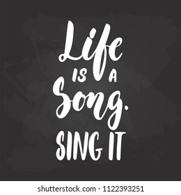 Life is a song. Sing it - hand drawn Musical lettering phrase isolated on the black chalkboard background. Fun brush chalk vector quote for banners, poster design, photo overlays.