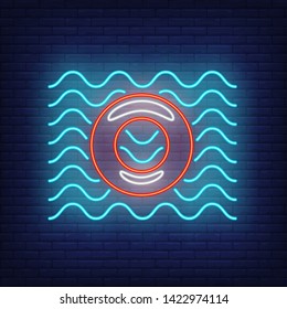 Lifebuoy on water neon sign. Lifesaver, waterpark, safety. Inflatable toy concept. Vector illustration in neon style for advertising, toy shop, entertainment, business