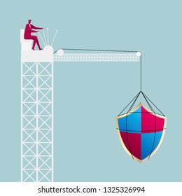 Lifting antivirus software symbol through the tower crane. Businessman driving a tower crane.