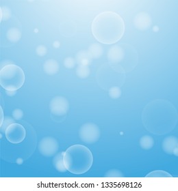 Light blue abstract background with a bokeh in the form of circles. Underwater world with air bubbles. Vector illustration