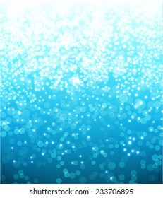 Light Blue Abstract Christmas Background with White Snowflakes 