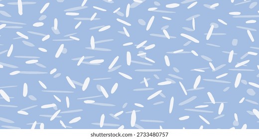Un fondo azul claro está adornado con numerosos granos de arroz blancos y de colores claros, creando un patrón abstracto y texturizado.
