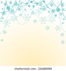 Light blue background with  snowflakes on a string of beads for greeting cards for new year or Christmas