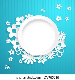 Light blue background with white circle and flowers cut out of paper