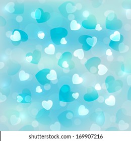 Light blue bokeh background with small hearts 