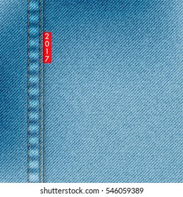 Light blue jeans texture. Denim background with red label and text 2017. Pattern can be used for wallpaper, pattern fills, web page background, surface textures. Denim texture