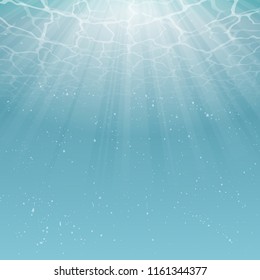 Light blue ocean under water background with magic lights