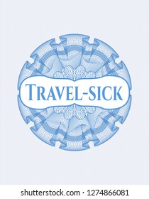 Light blue passport rosette with text Travel-sick inside