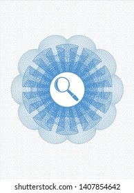 Light blue passport style rosette with magnifying glass icon inside