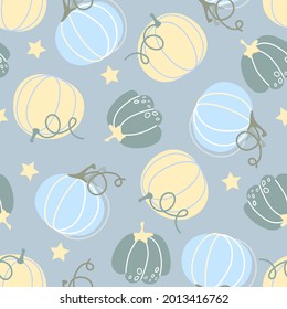 Light and blue pumpkins on a light blue background with asterisks. Seamless pattern