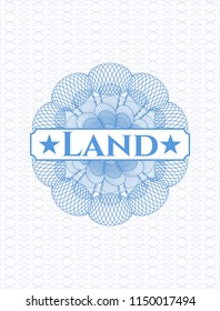 Light blue rosette (money style emblem) with text Land inside