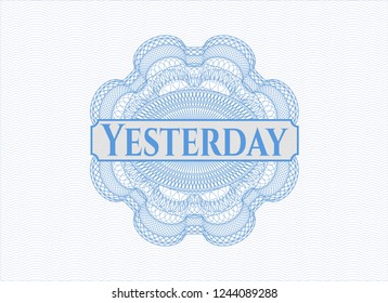 Light blue rosette or money style emblem with text Yesterday inside