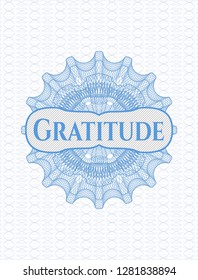 Light blue rosette or money style emblem with text Gratitude inside