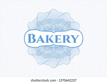 Light blue rosette or money style emblem with text Bakery inside