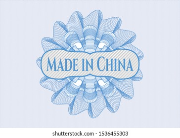 Light blue rosette or money style emblem with text Made in China inside