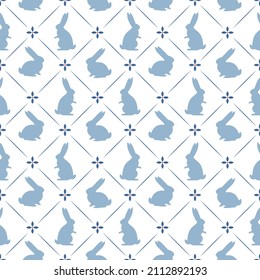 Light blue seamless background. Hand-drawn rabbits in vintage style. Pattern for wallpaper, fabric,packaging.