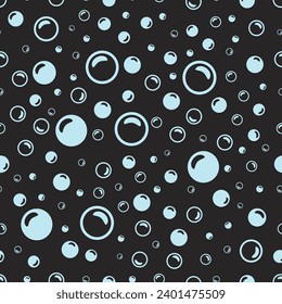light blue soap bubbles on a black background