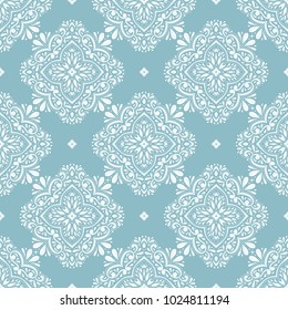 Light blue and white ornamental seamless pattern. Vintage, paisley elements. Ornament. Traditional, Ethnic, Turkish, Indian motifs. Great for fabric and textile, wallpaper, packaging.