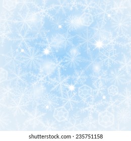 Light blue winter background made from snowflakes.