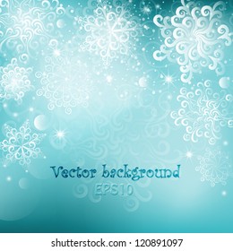 Light blue winter background with snowflakes