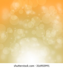 light and bokeh on orange and yellow background for christmas backdrop