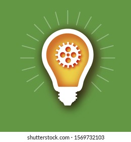 Light bulb and cog inside in paper cut style. Origami Electric bulb with gears and cogs working together. Concept of a business idea. Teamwork. Strategy. Cooperation. Green background.