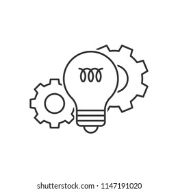 Light bulb and cog wheels