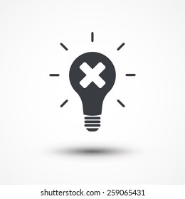 Light bulb and cross mark